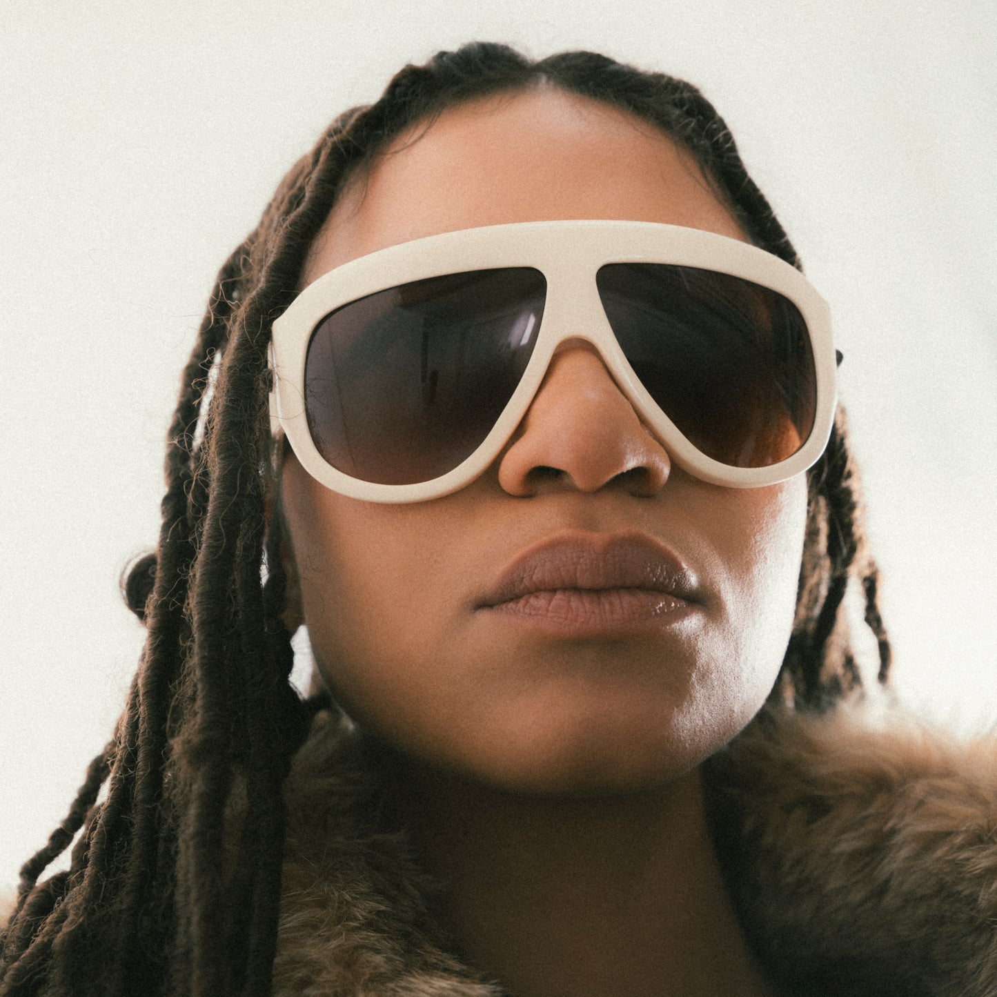 Ivory oversized aviator sunglasses with bold acetate frame – worn by female model