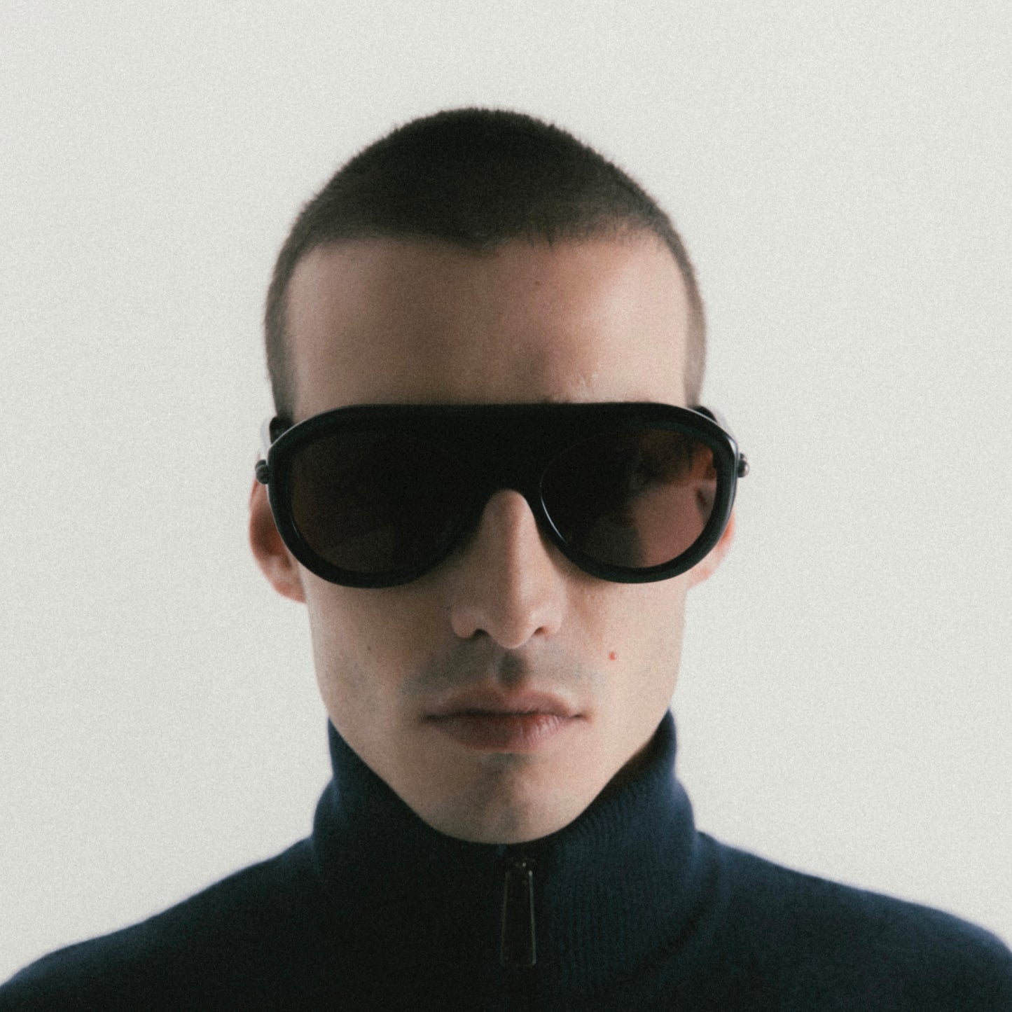 Black aviator sunglasses with acetate frame – worn by male model, front view