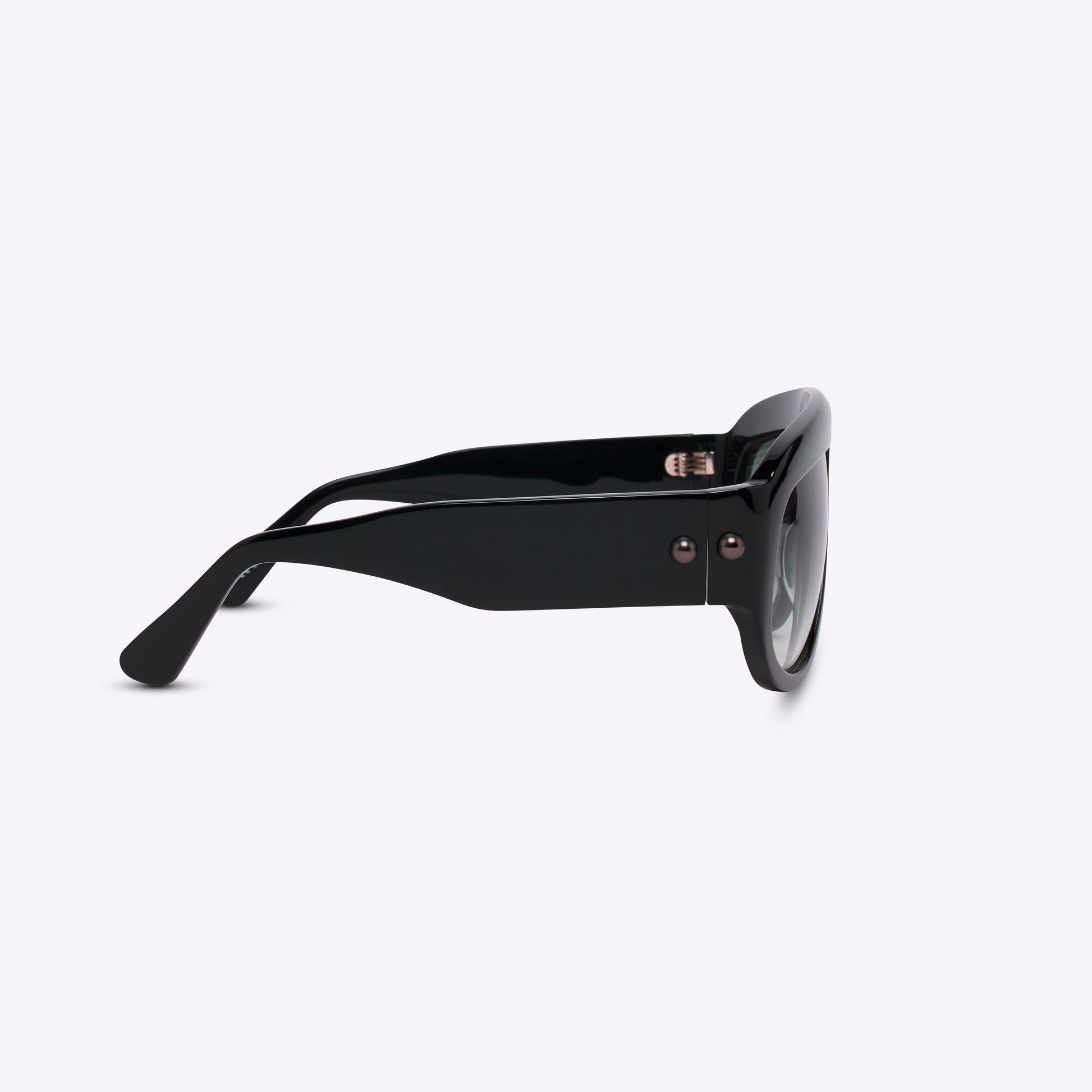Black oversized aviator sunglasses with bold acetate frame – temple detail on white background