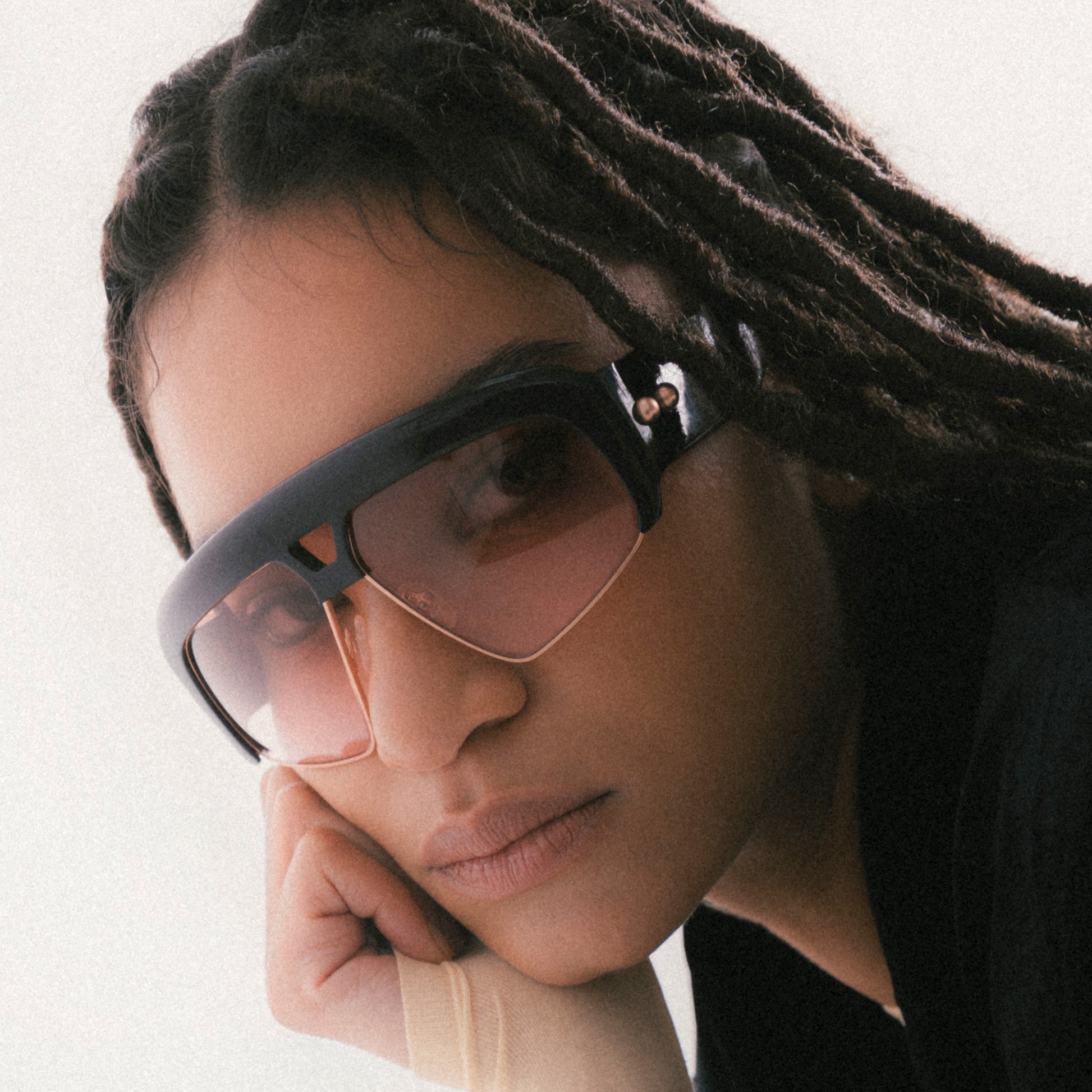 Deep brown oversized aviator sunglasses with acetate and metal frame – female model front portrait view