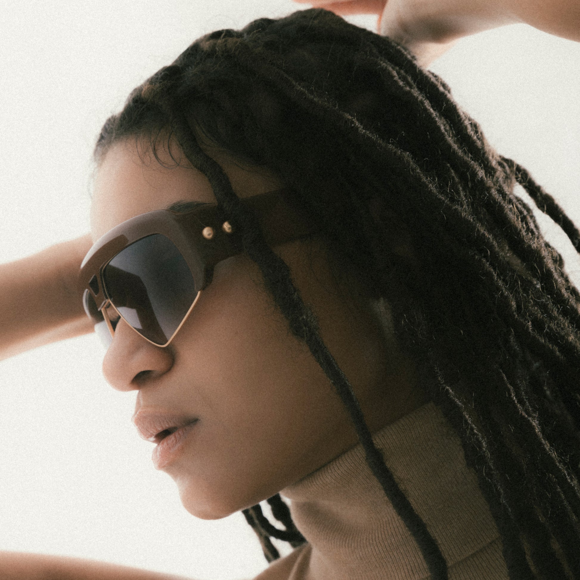 Brown oversized aviator sunglasses with acetate and metal frame – female model side profile view
