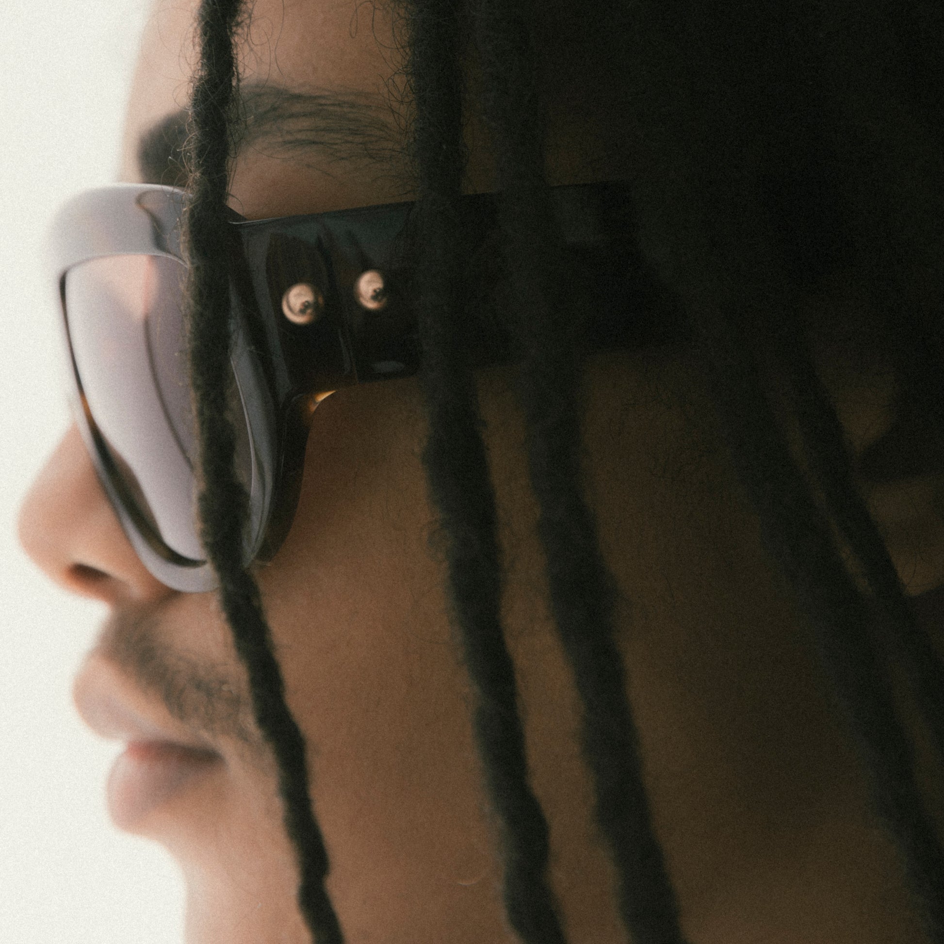 Tortoiseshell oversized aviator sunglasses with bold acetate frame – worn by male model – detail portrait