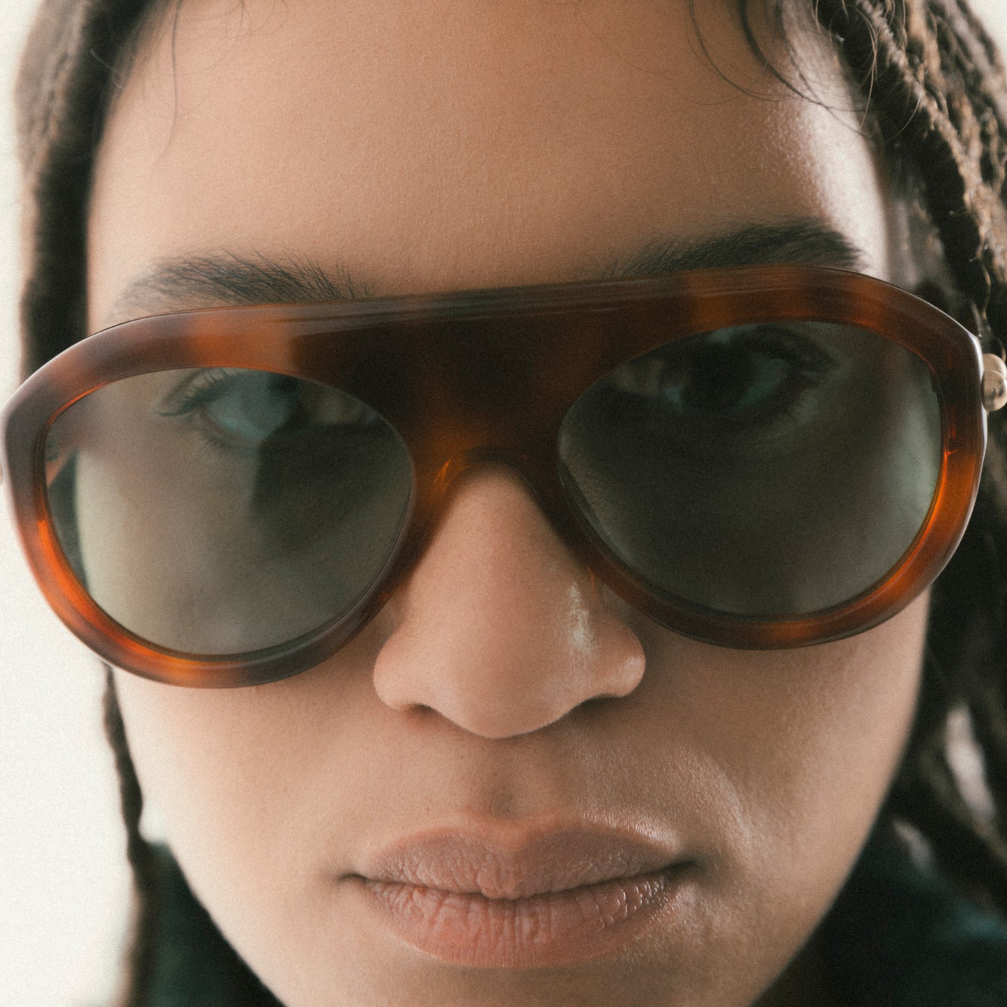 Brown aviator sunglasses in Havana acetate – worn by female model, front view
