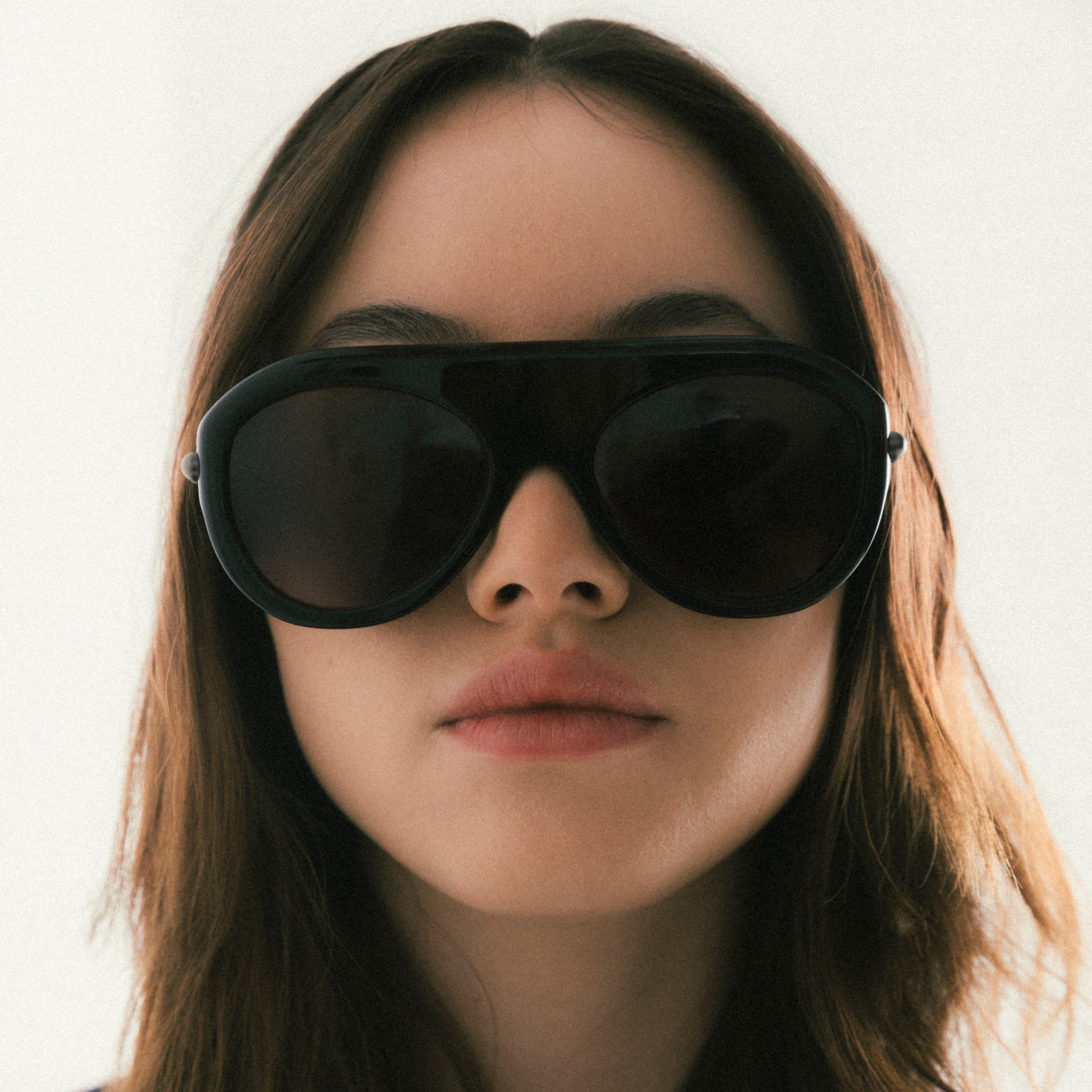 Black aviator sunglasses with acetate frame – worn by female model, front view