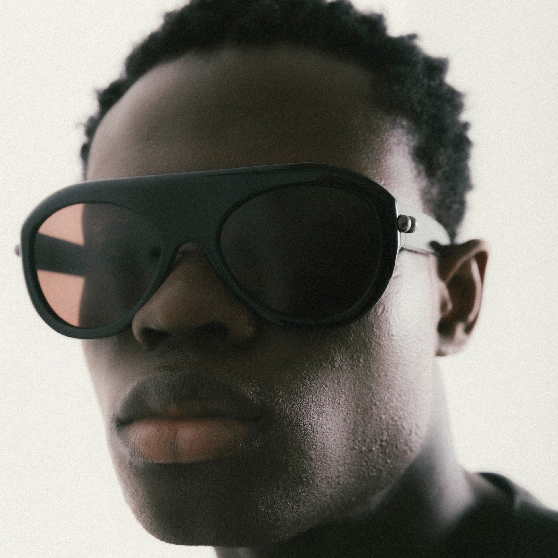 Black aviator sunglasses with acetate frame – worn by male model, side view
