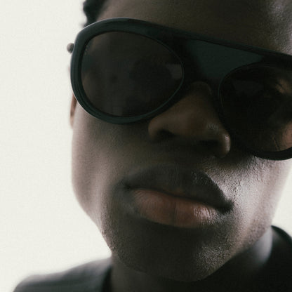 Black aviator sunglasses with acetate frame – worn by male model, front view close-up